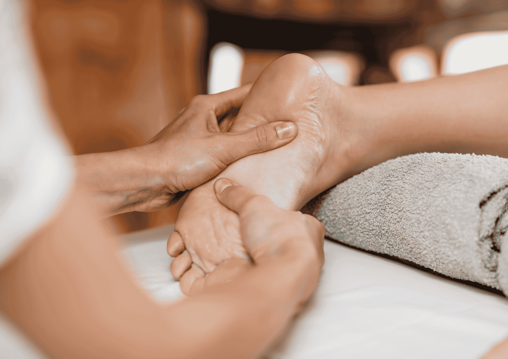 Therapist performing a relaxing foot massage treatment for a client